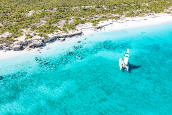 Aerial view of classic sailing catamaran in the Turks and Caicos.
