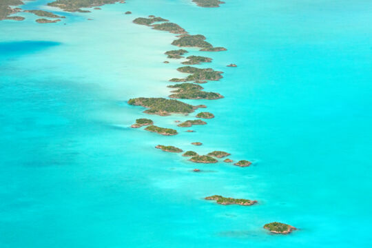 Aerial view of small limestone islands in Chalk Sound National Park