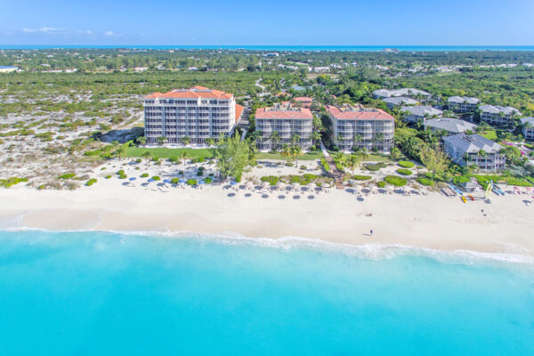 Aerial photo of Grace Bay Beach, the Venetian Resort, the Tuscany Resort, and Ocean Club Resort