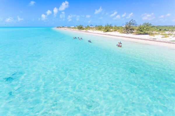 Horseback riding in the turquoise water at Long Bay Beach on Providenciales