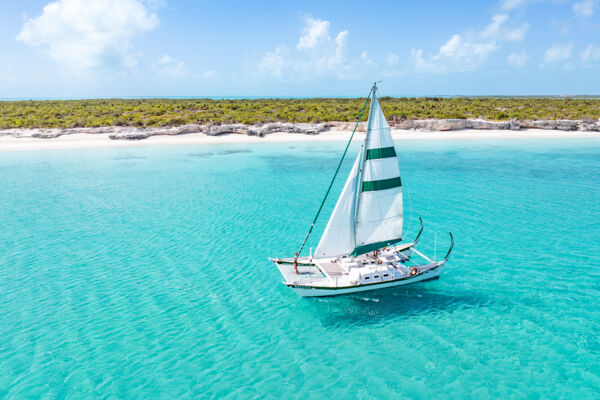 Aerial view of a sailing catamaran at Water Cay
