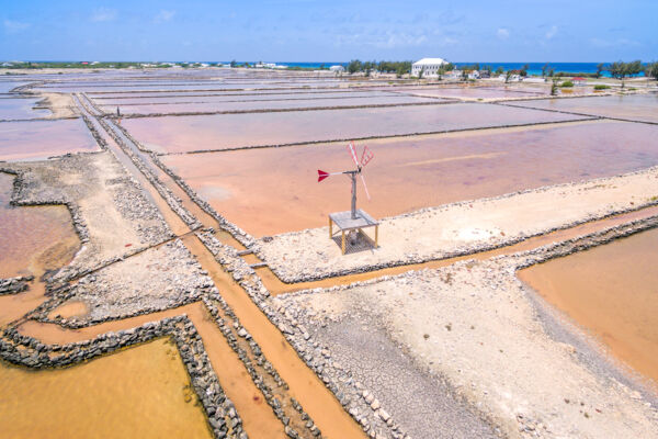 Aerial view of windmill and salt salinas on Salt Cay in the Turks and Caicos