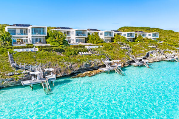 Luxury villas on a beautiful rocky coastline fronting crystal-clear turquoise ocean water