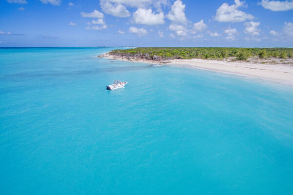 Small powerboat at Half Moon Bay Beach near Water Cay