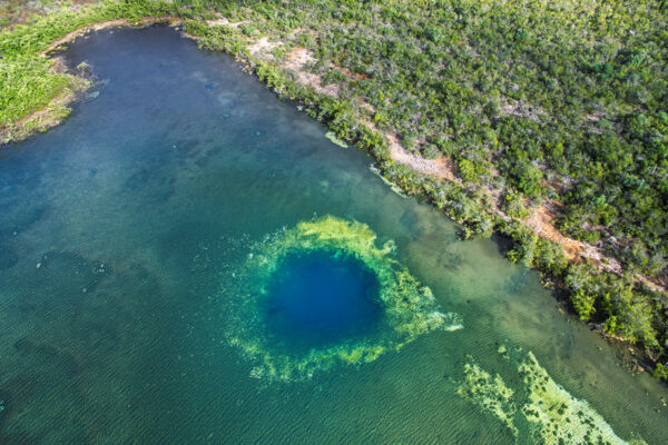 Aerial view of pond and blue hole in the Turks and Caicos