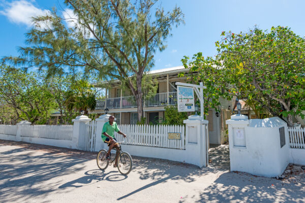 Cyclist and villas on Duke Street in Cockburn Town