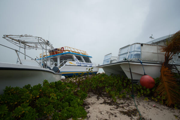 Dive boats washed on land after Hurricane Hanna