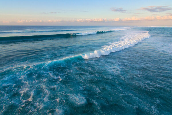 The swell and breaking waves at Northwest Point Marine National Park at sunset