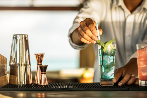 Butler creating drinks at Parrot Cay Resort