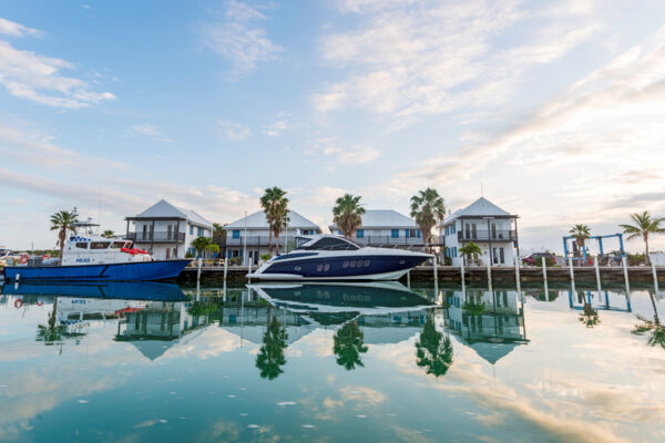 Royal Turks and Caicos Police vessel and yacht at Caicos Marina at dawn