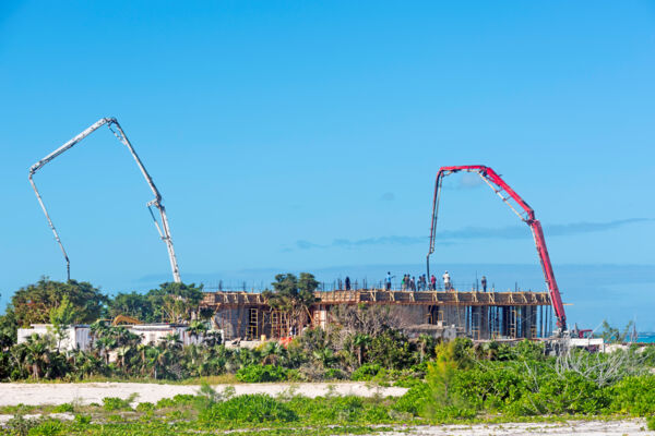 Concrete pump trucks at a home construction site in the Turks and Caicos