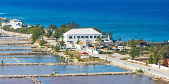 Aerial photo of the Salt Cay Salinas, the Harriott White House, and Victoria Street