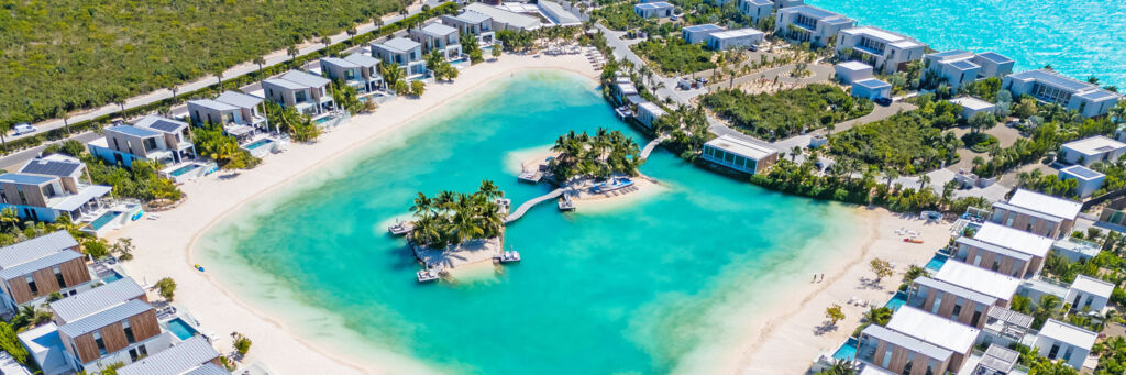 Aerial of a resort with a large lagoon in Turks and Caicos.