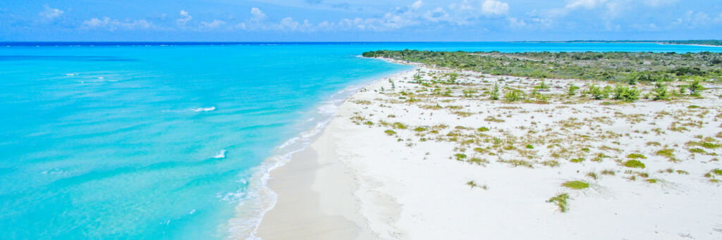 Beautiful wide expansive beach at Fort George Cay.