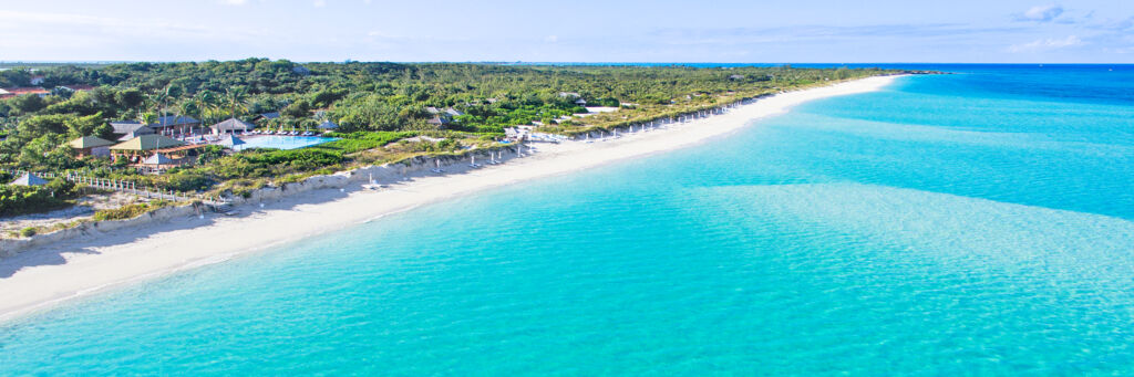 The beautiful beach and turquoise water at Parrot Cay Resort