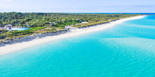 The beautiful beach and turquoise water at Parrot Cay Resort