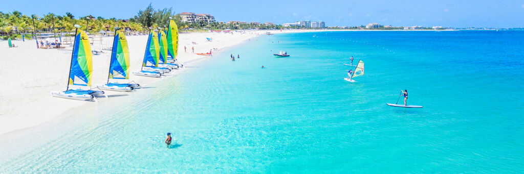 Grace Bay Beach and Hobie cat sailboats and stand up paddle boards