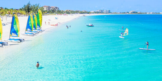 Grace Bay Beach and Hobie cat sailboats and stand up paddle boards