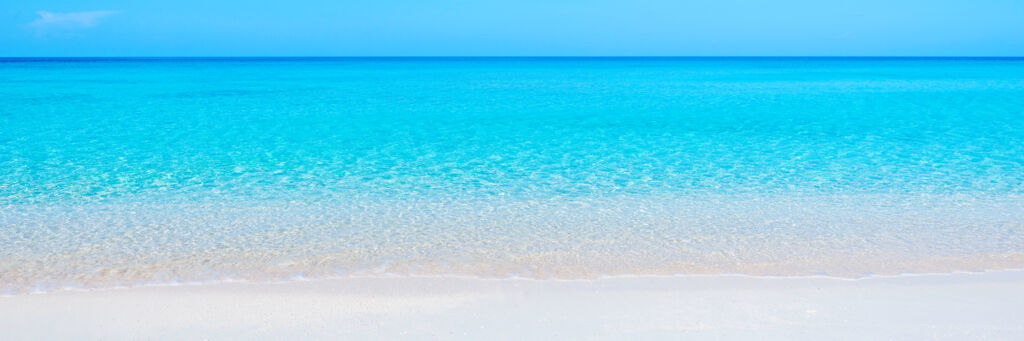 White sand and calm turquoise ocean at Governor's Beach in the Turks and Caicos