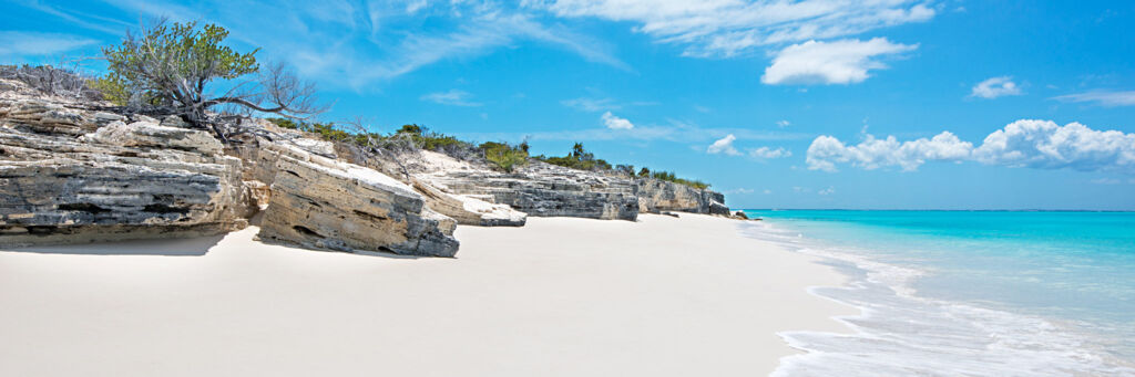 Semi-lithified marine limestone cliffs on the northern Water Cay beach