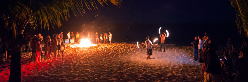 Fire dancing and bonfire at Long Bay Beach