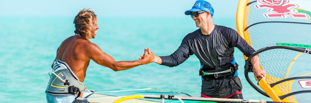 Brian Talma and Kevin Pritchard in the water at Long Bay Beach