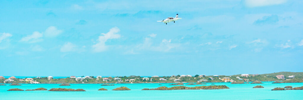 Caicos Express Piper Aztec over Chalk Sound in the Turks and Caicos