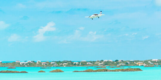 Caicos Express Piper Aztec over Chalk Sound in the Turks and Caicos