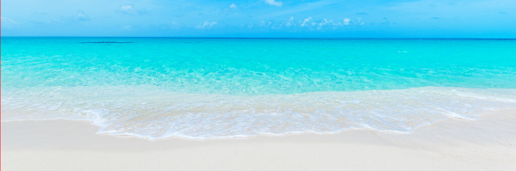 Calm turquoise water and white sand at Grace Bay Beach