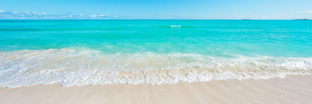 Wave on the beach and turquoise ocean at Cedar Point 