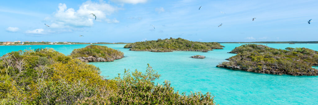Small limestone islands and turquoise water at Chalk Sound National Park 