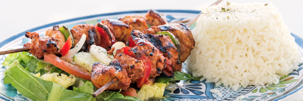 Chicken shish kebab with salad and rice