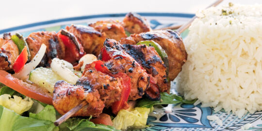 Chicken shish kebab with salad and rice