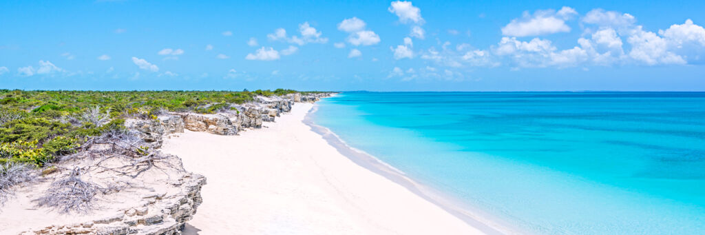 White sand and blue and turquoise ocean at Water Cay