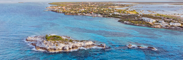 Dove Cay and the main South Caicos settlement of Cockburn Harbour at sunset. 