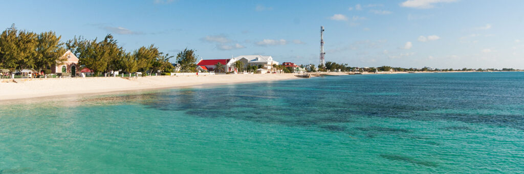 The ocean and beach fronting Cockburn Town late in the afternoon