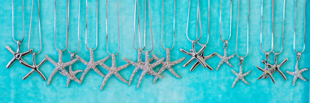 Silver starfish necklaces in a Grace Bay gift shop