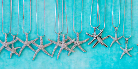 Silver starfish necklaces in a Grace Bay gift shop