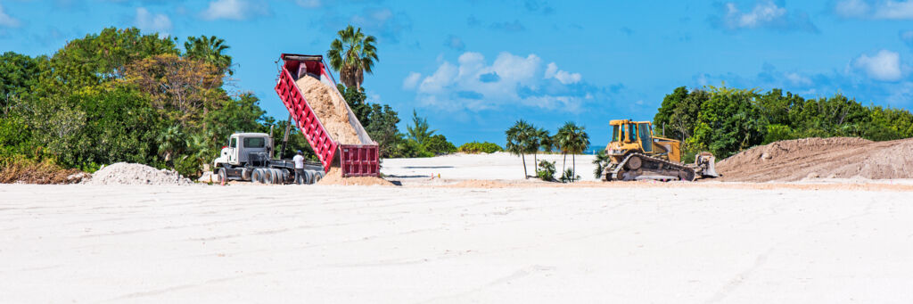 Dump truck and bulldozer working at Leeward on Providenciales