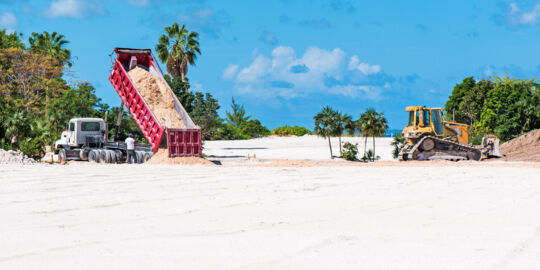 Dump truck and bulldozer working at Leeward on Providenciales