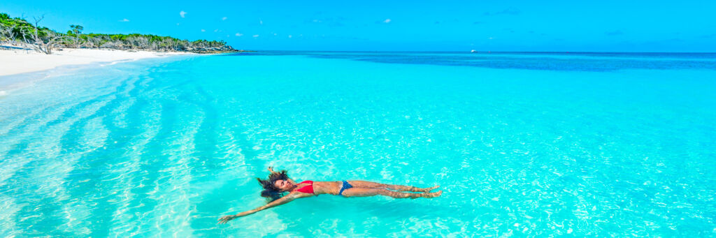 Floating in the amazing clear ocean water at Little Water Cay