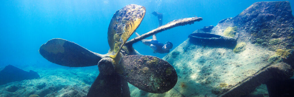 Freediver and large shipwreck prop in Turks and Caicos