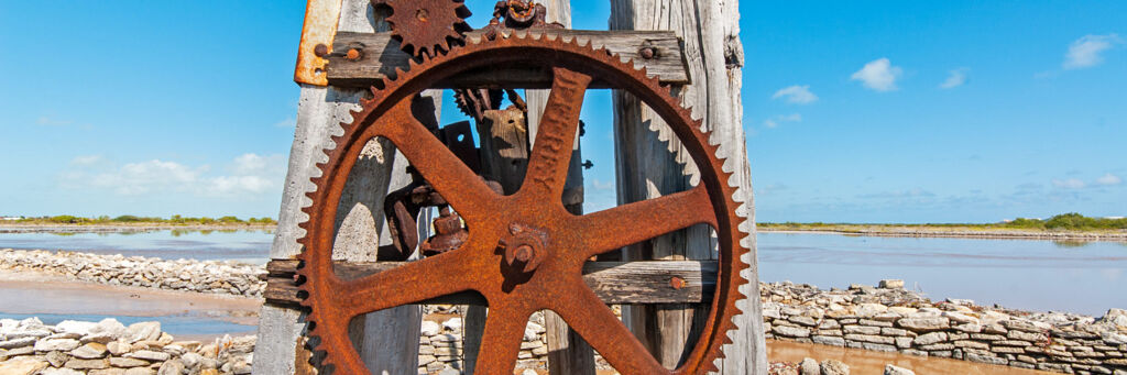 Metal windmill pump gears on the salinas of South Caicos