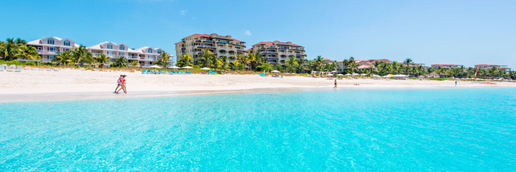 People walking on the beautiful Grace Bay Beach