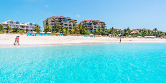 People walking on the beautiful Grace Bay Beach