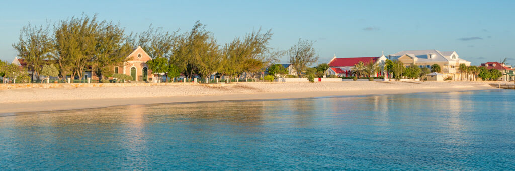 The beachfront Cockburn Town at sunset