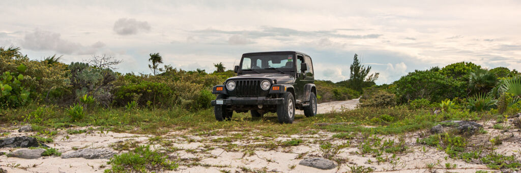 Exploring the coastal roads of North Caicos with a Jeep Wrangler
