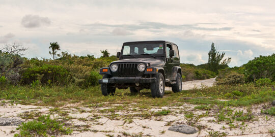 Exploring the coastal roads of North Caicos with a Jeep Wrangler