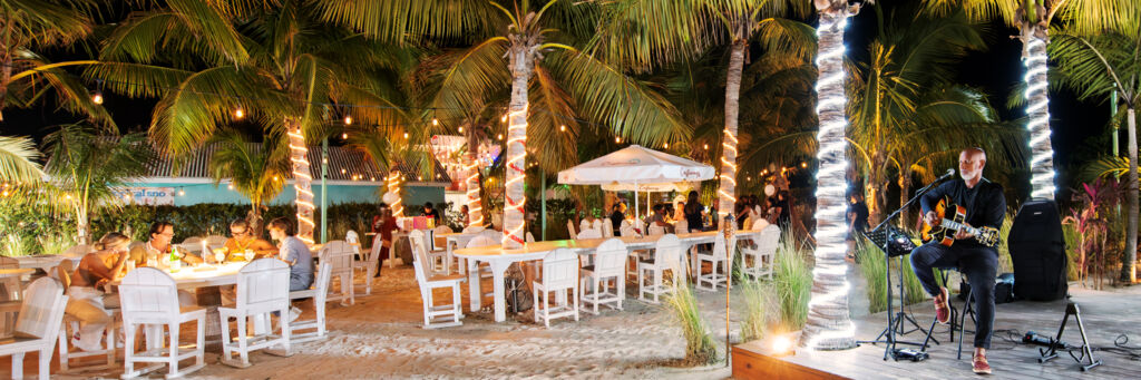 Dinners and musician Gordon Lightbourne at Castaways restaurant in Grace Bay.
