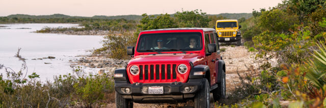 Red Jeep Wrangler exploring Frenchman's Creek Nature Reserve, Turks and Caicos. 